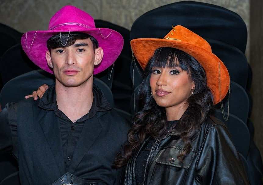 Guests in pink and orange Numa hats